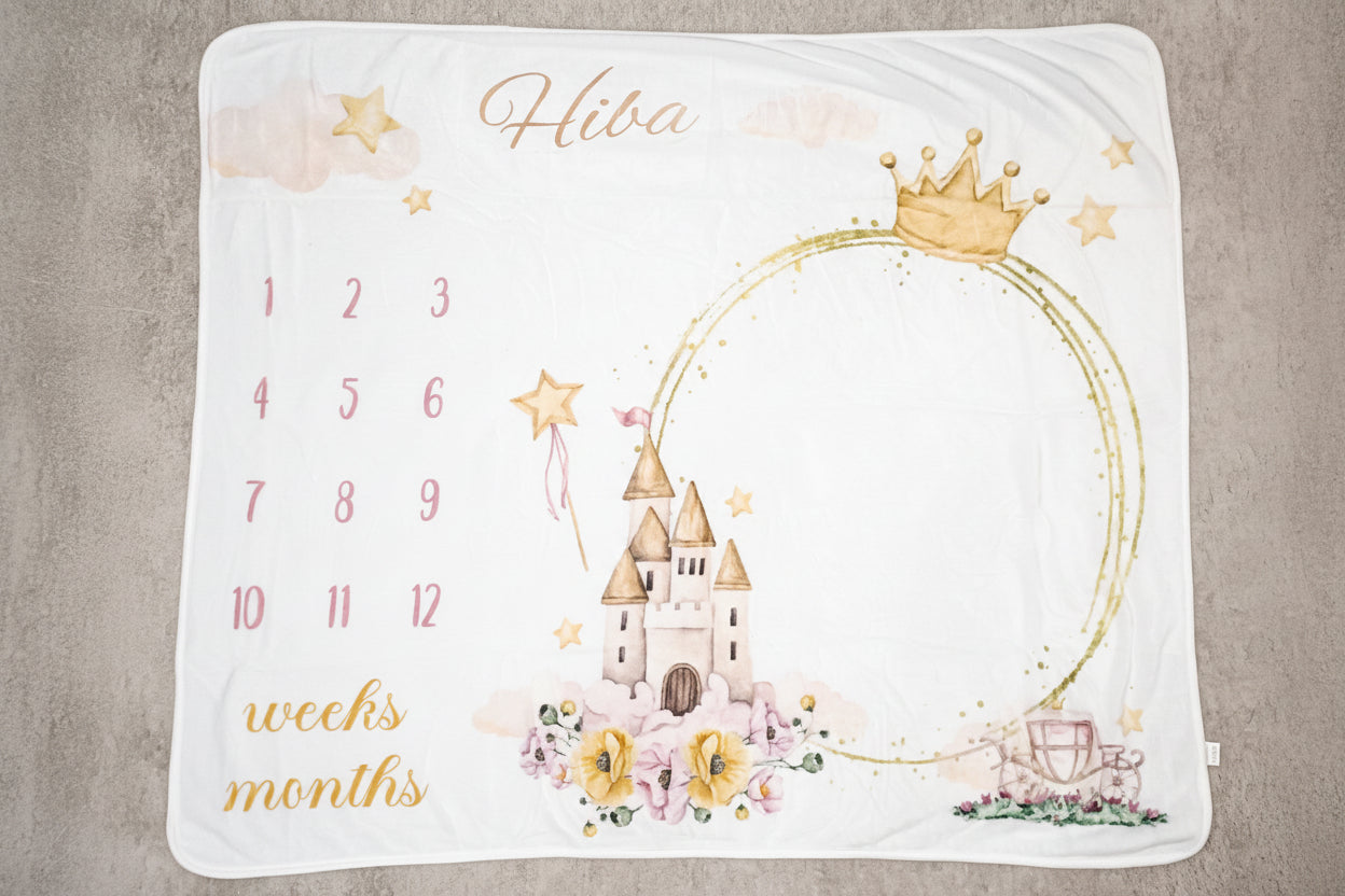 Baby milestone blanket with castle design and 'Hiba' text on a neutral background