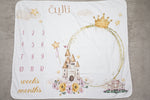 Baby milestone blanket with castle design and numbers on a plain background